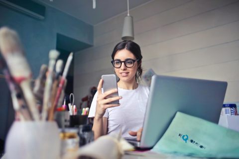 Woman in art room on phone